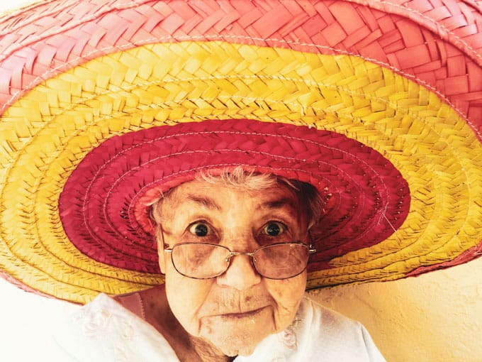 Old lady wearing a sombrero. 