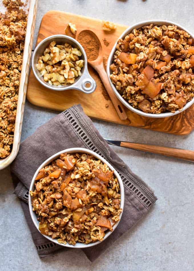 Cinnamon apple oatmeal crumble in two bowls.