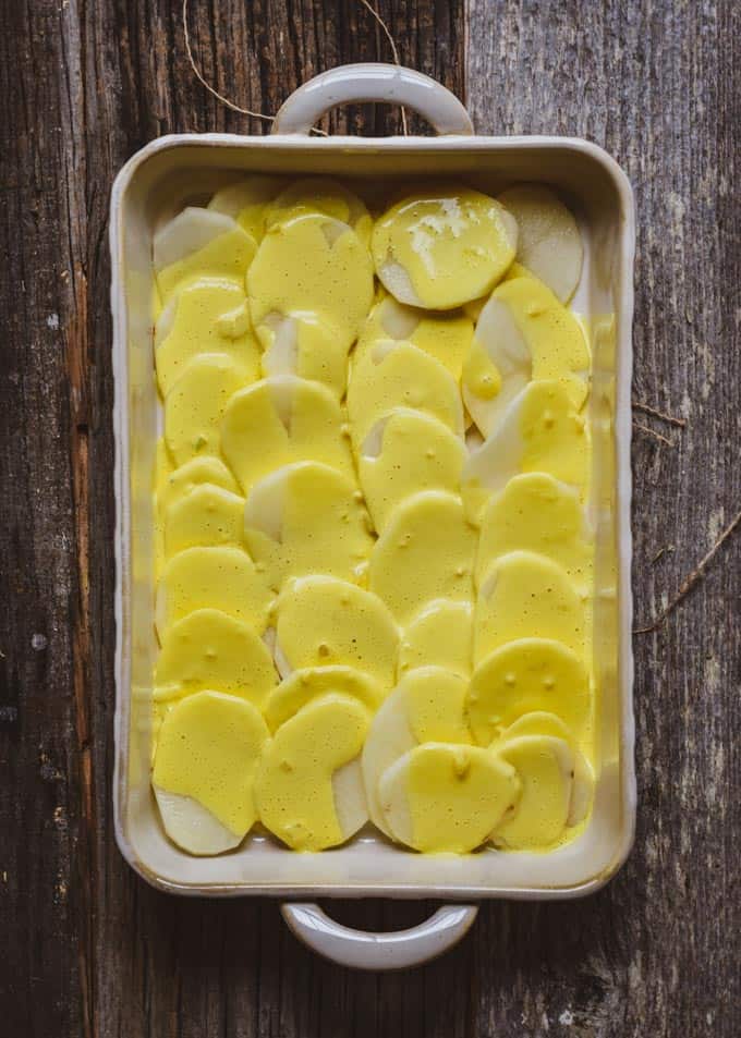 Creamy vegan scalloped potatoes before being cooked with cheese sauce.