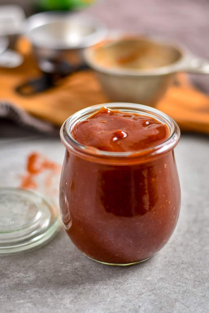 Easy homemade bbq sauce in jar on table.