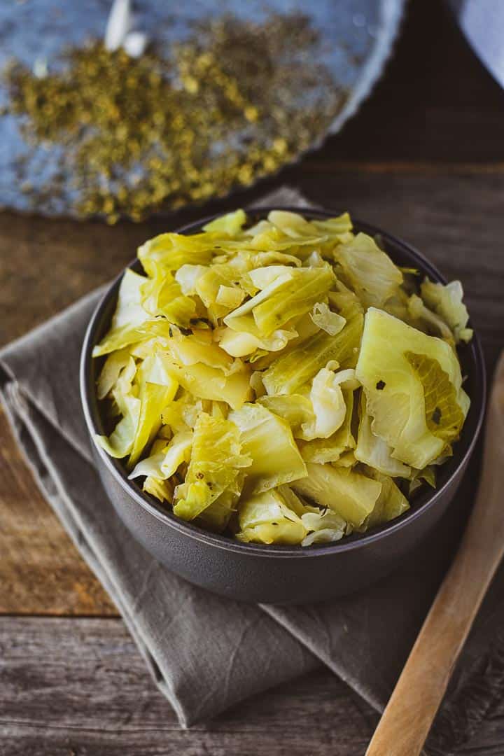 Easy Instant Pot cabbage on table with tray and gray napkin.