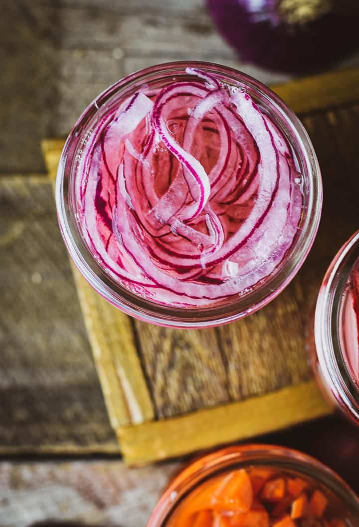 Pickled onions in jar without lid.