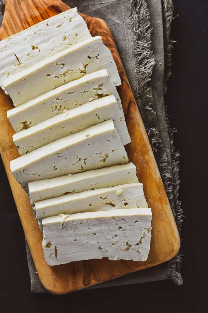 Sliced tofu on a cutting board.