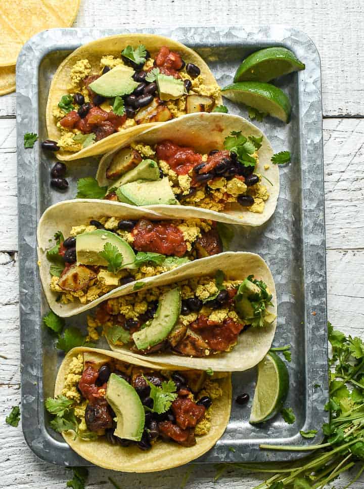 Vegan breakfast tacos on tray.