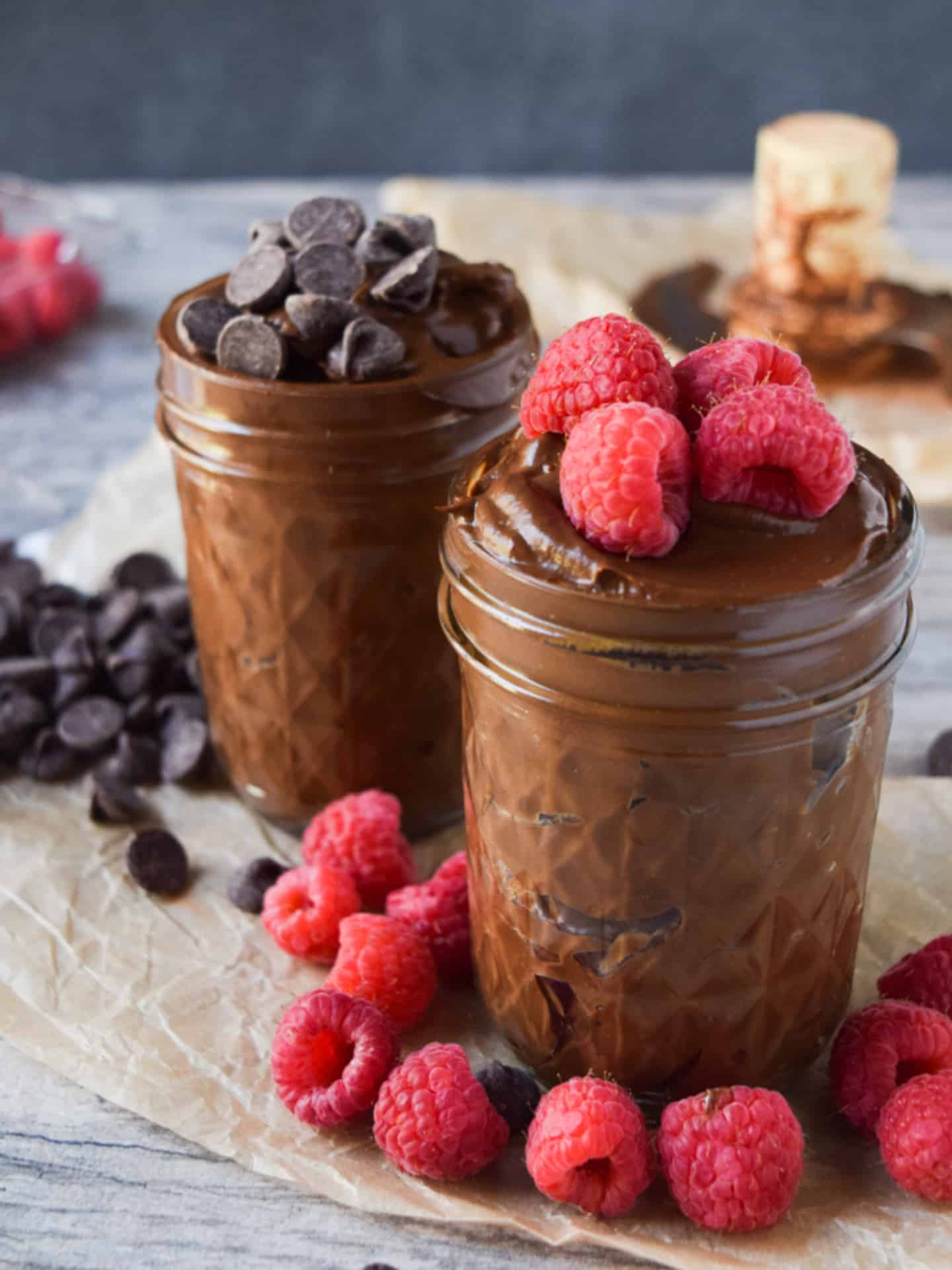 Avocado chocolate pudding with chocolate chips and raspberries.