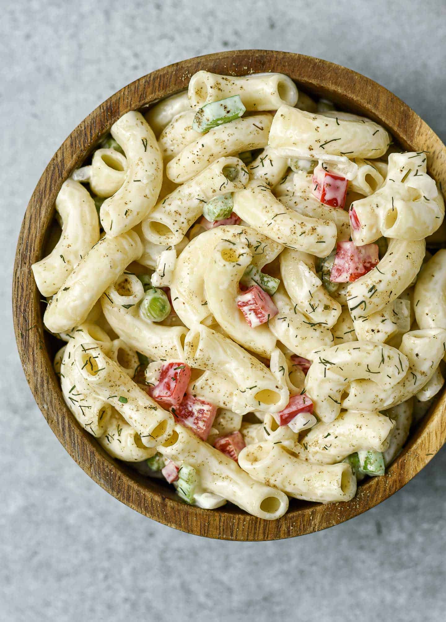 Vegan pasta salad in wooden bowl.