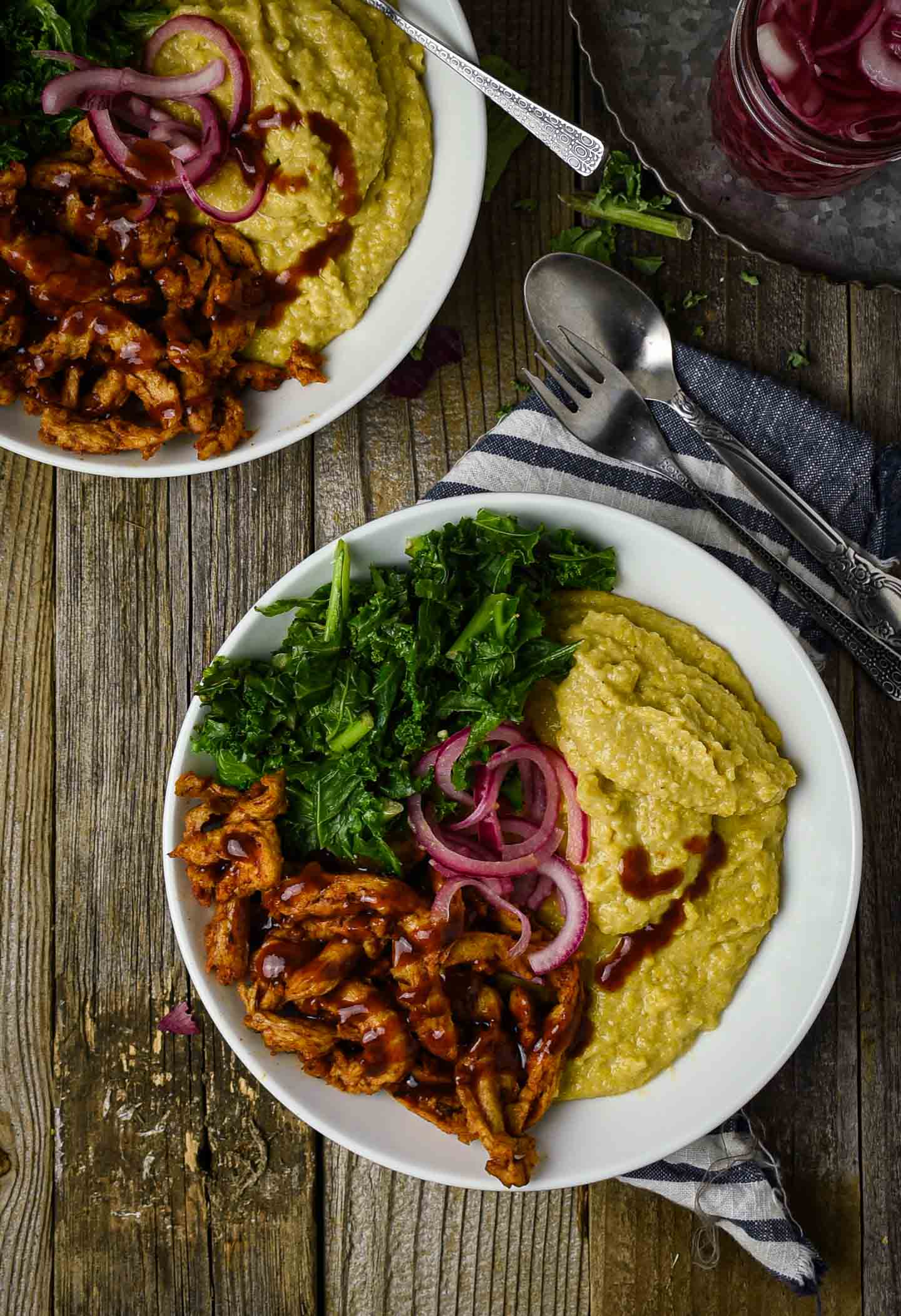 Vegan Grits Bowl with BBQ Soy Curls and Sauteed Kale is the definition of comfort food. A delicious and healthy plant-based breakfast bowl featuring creamy cheesy grits, hearty bbq soy curls, and greens.