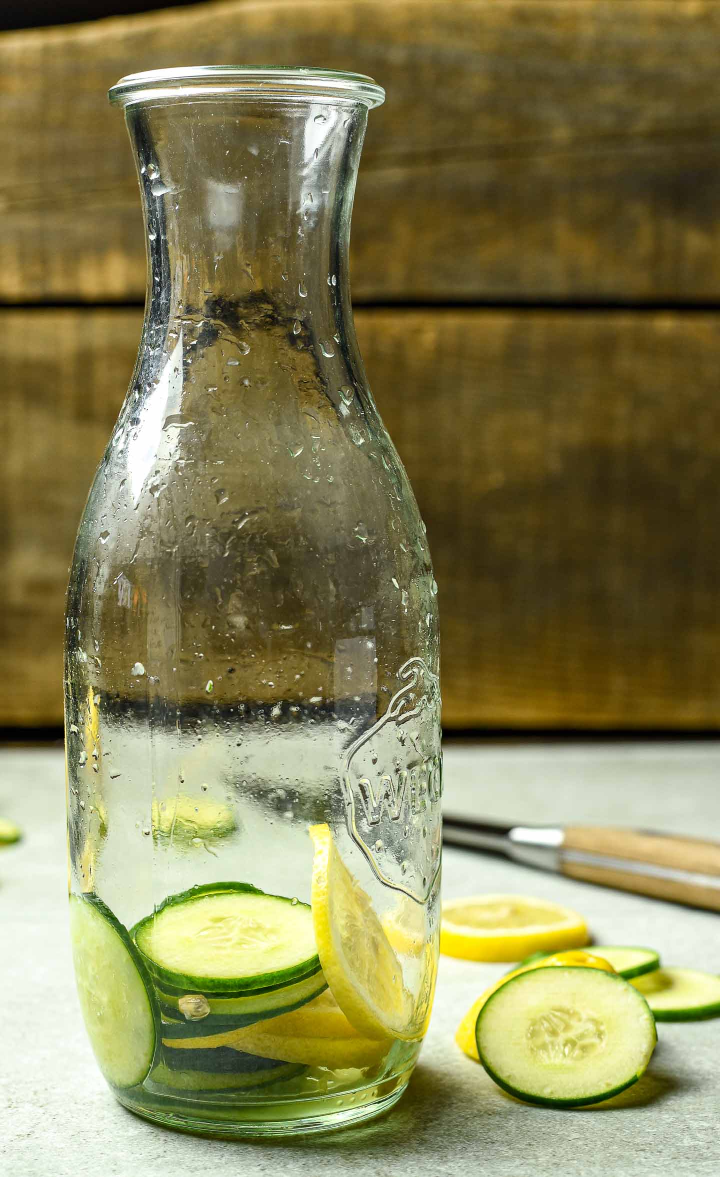 Deliciously refreshing lemon cucumber water made with only lemons, cucumbers, and water. Garnish with fresh mint or berries of your choice. Perfect day or night.