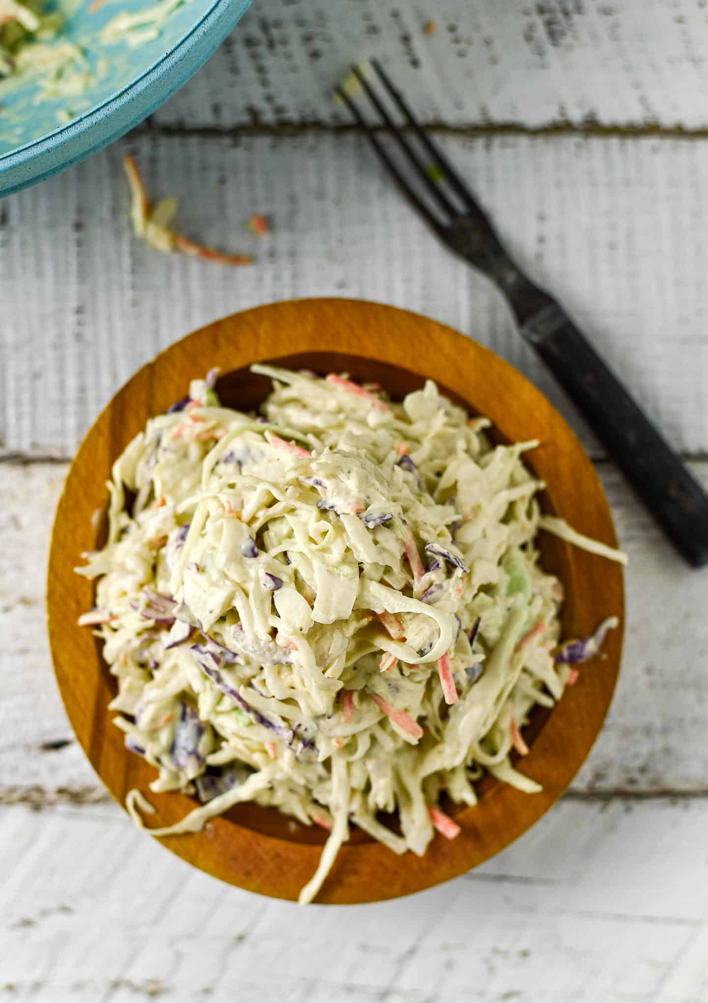 Easy Vegan Coleslaw is creamy, delicious, and so easy to make. Made in one bowl with 5 ingredients, it's perfect for BBQs, picnics, and summer potlucks! Oil-free, gluten-free, and healthy.