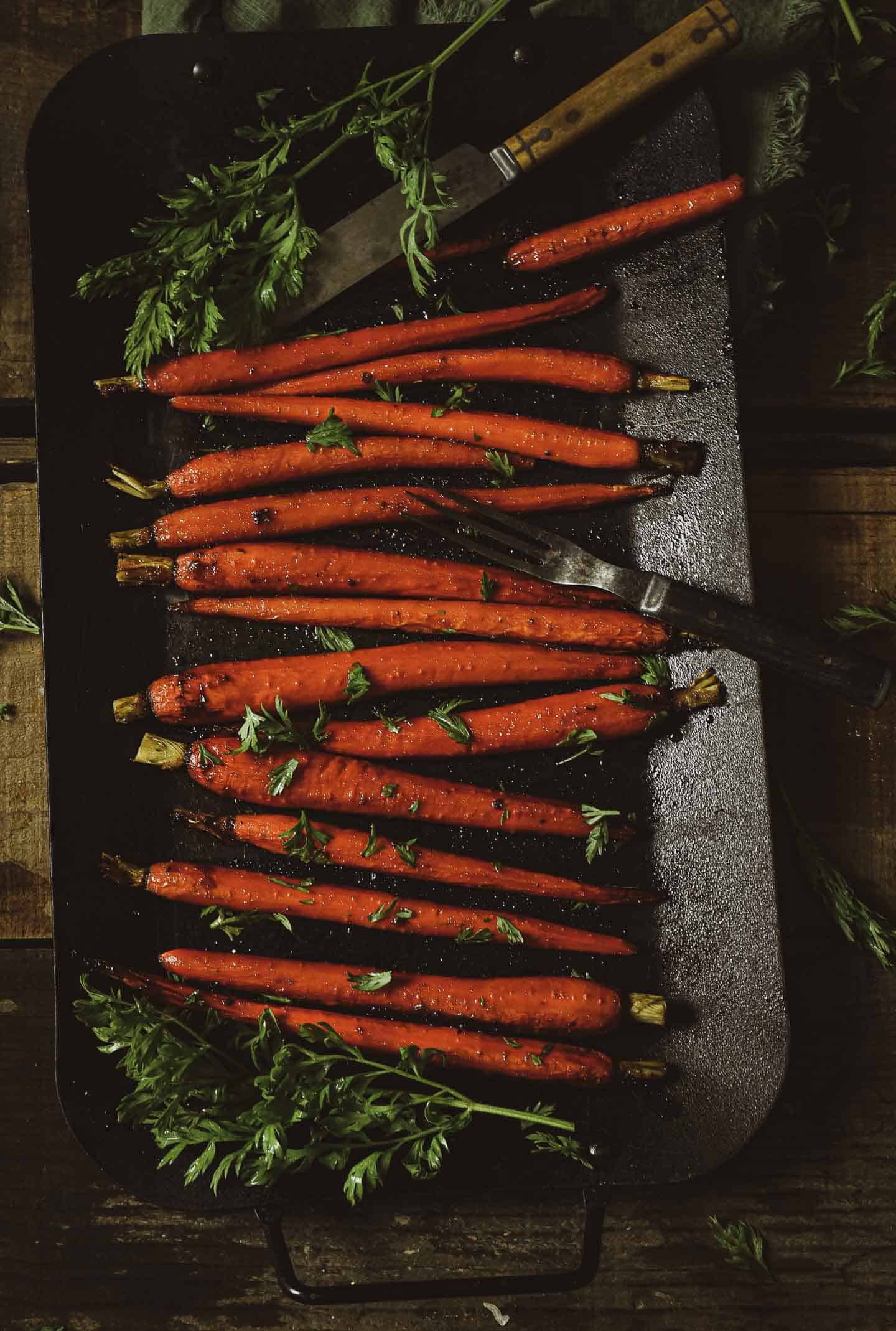 These Maple Roasted Carrots are sweet, savory, and so easy to make. All you need are 7 simple ingredients to make a delicious side dish even kids will love! Vegan, oil-free, and healthy.