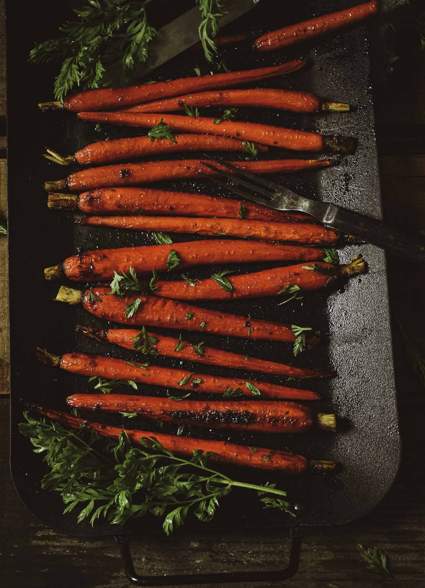 These Maple Roasted Carrots are sweet, savory, and so easy to make. All you need are 7 simple ingredients to make a delicious side dish even kids will love! Vegan, oil-free, and healthy.