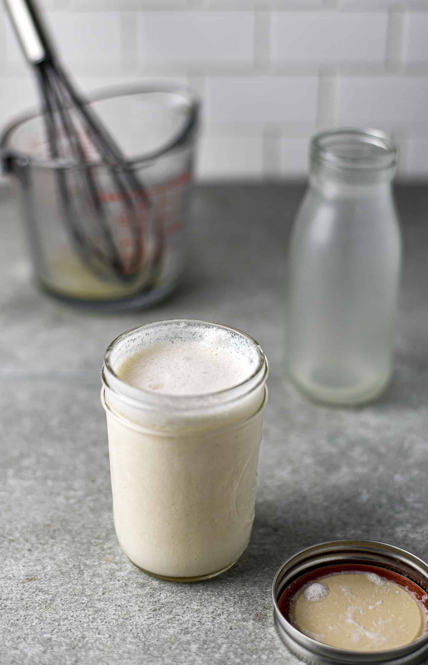Vegan buttermilk in small mason jar.