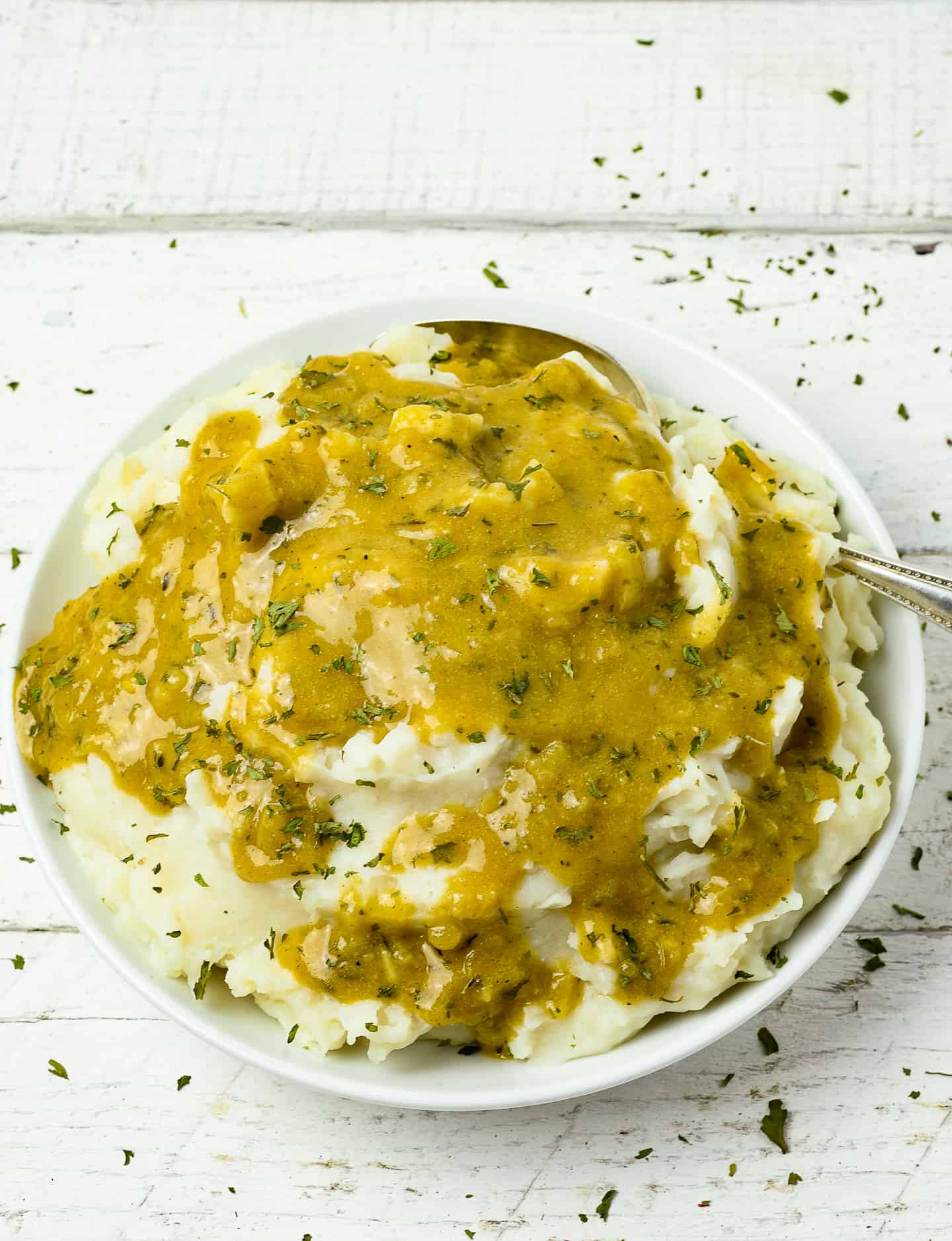 Bowl of mashed potatoes and gravy.