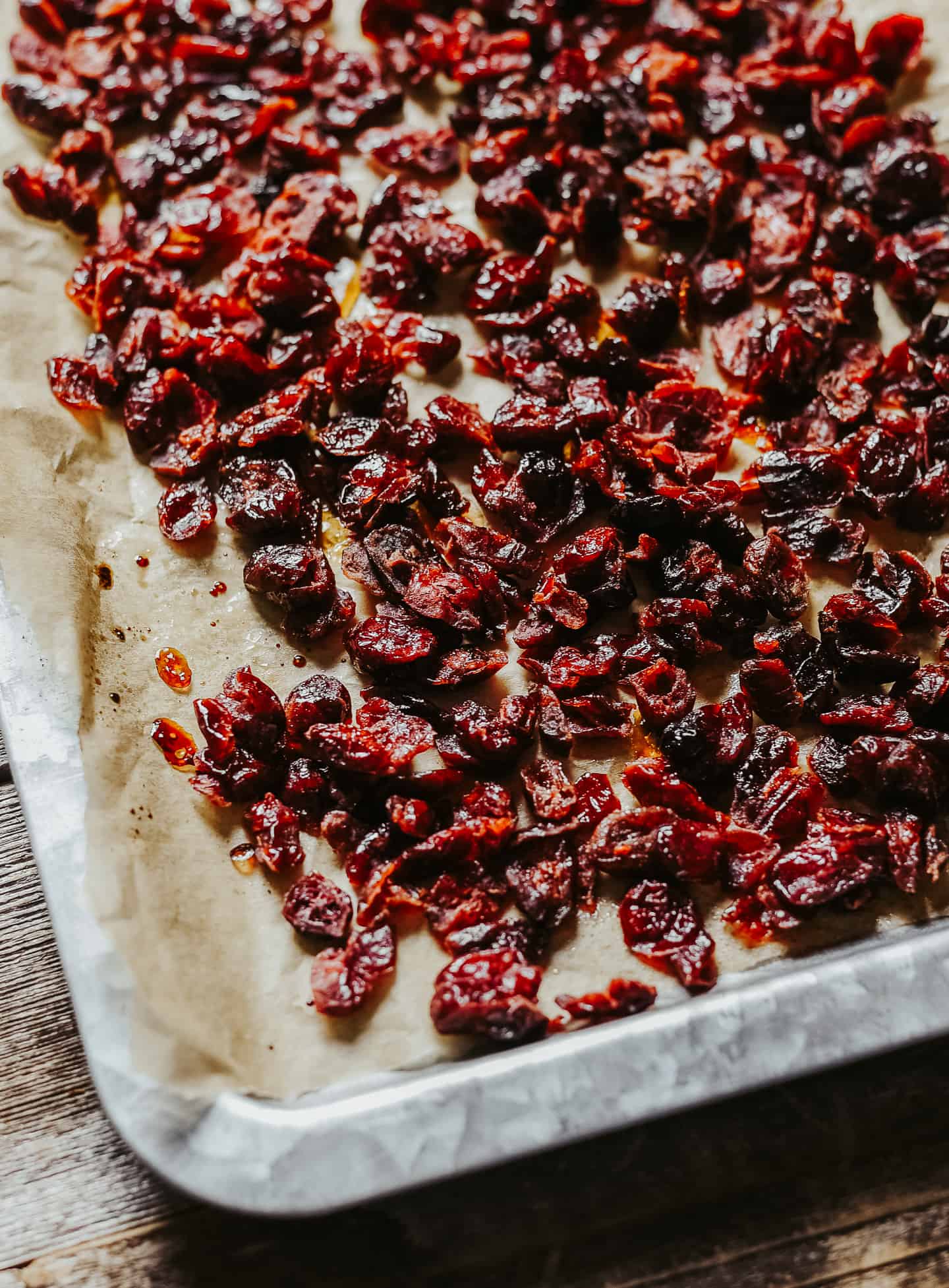 Dehydrated cranberries on baking sheet.