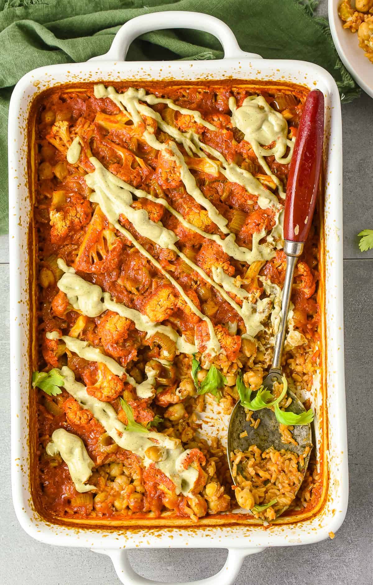 Buffalo chickpea cauliflower casserole with spoon.