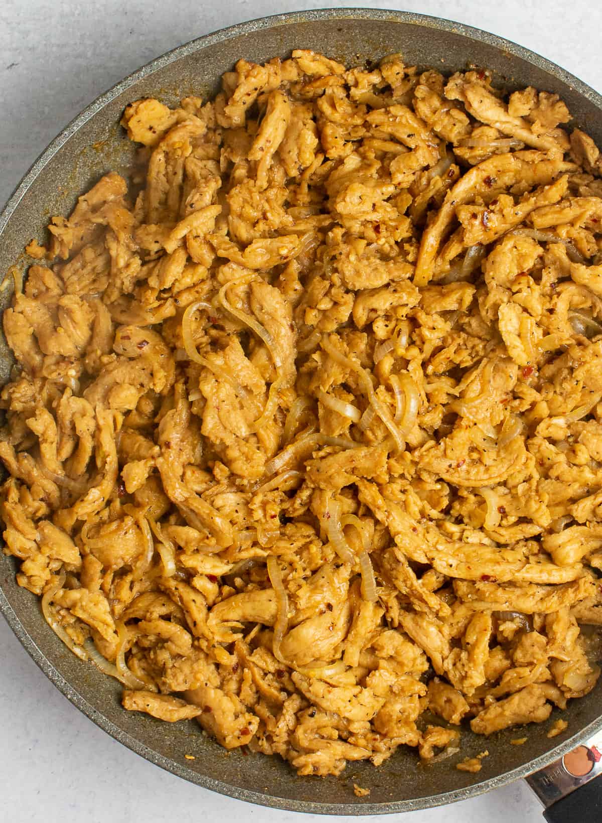 Soy curls and onions in skillet.