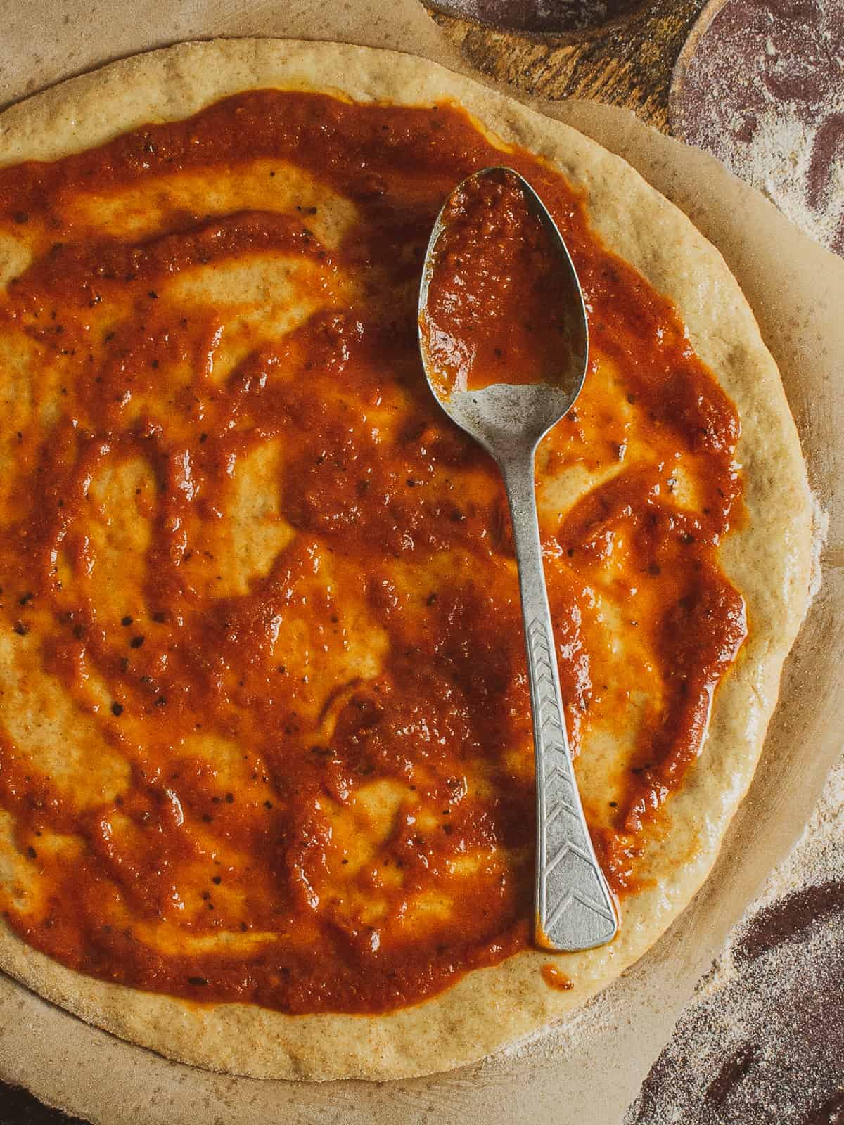 pizza dough with sauce