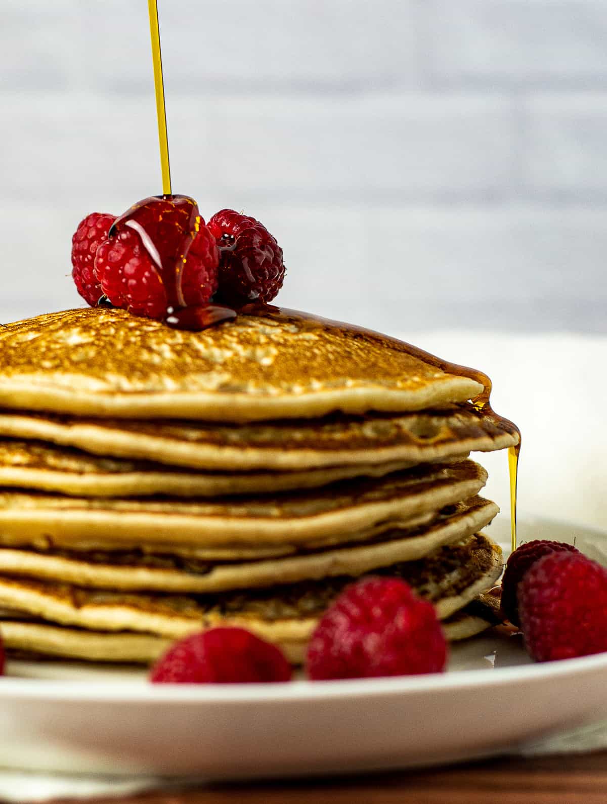 Pancakes with raspberries and maple syrup