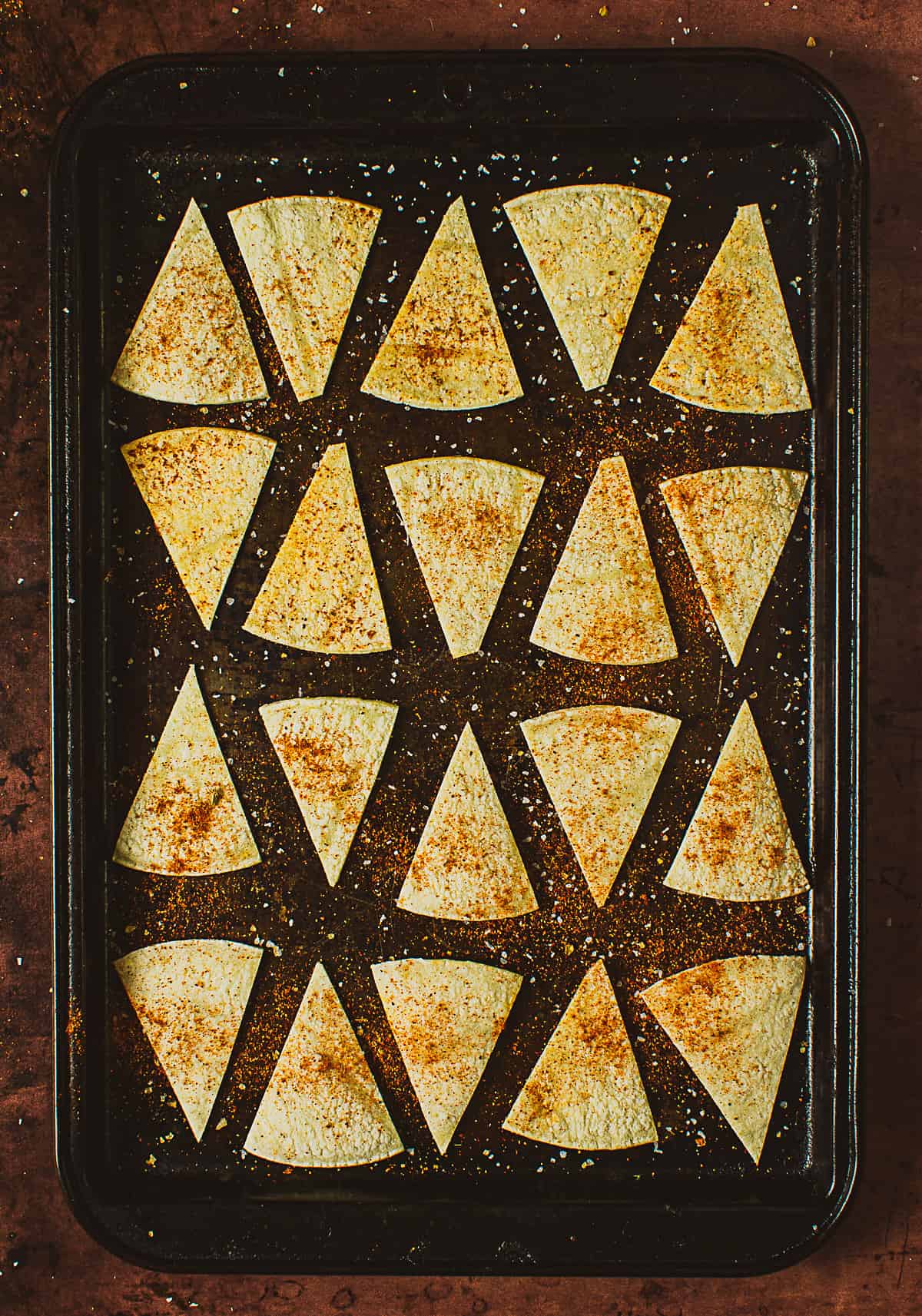 sliced tortillas on baking sheet