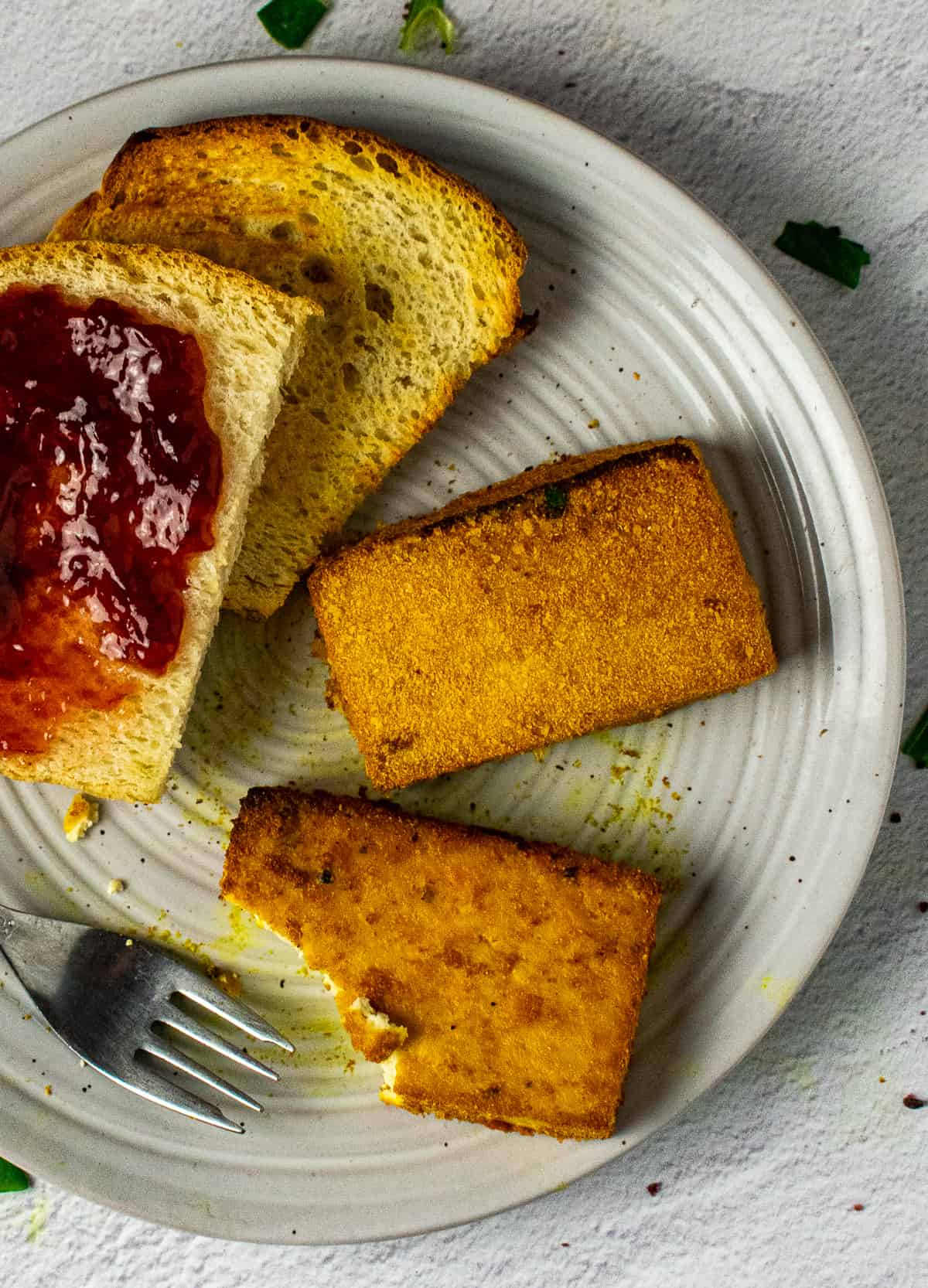 eggy tofu patties on plate with fork and toast