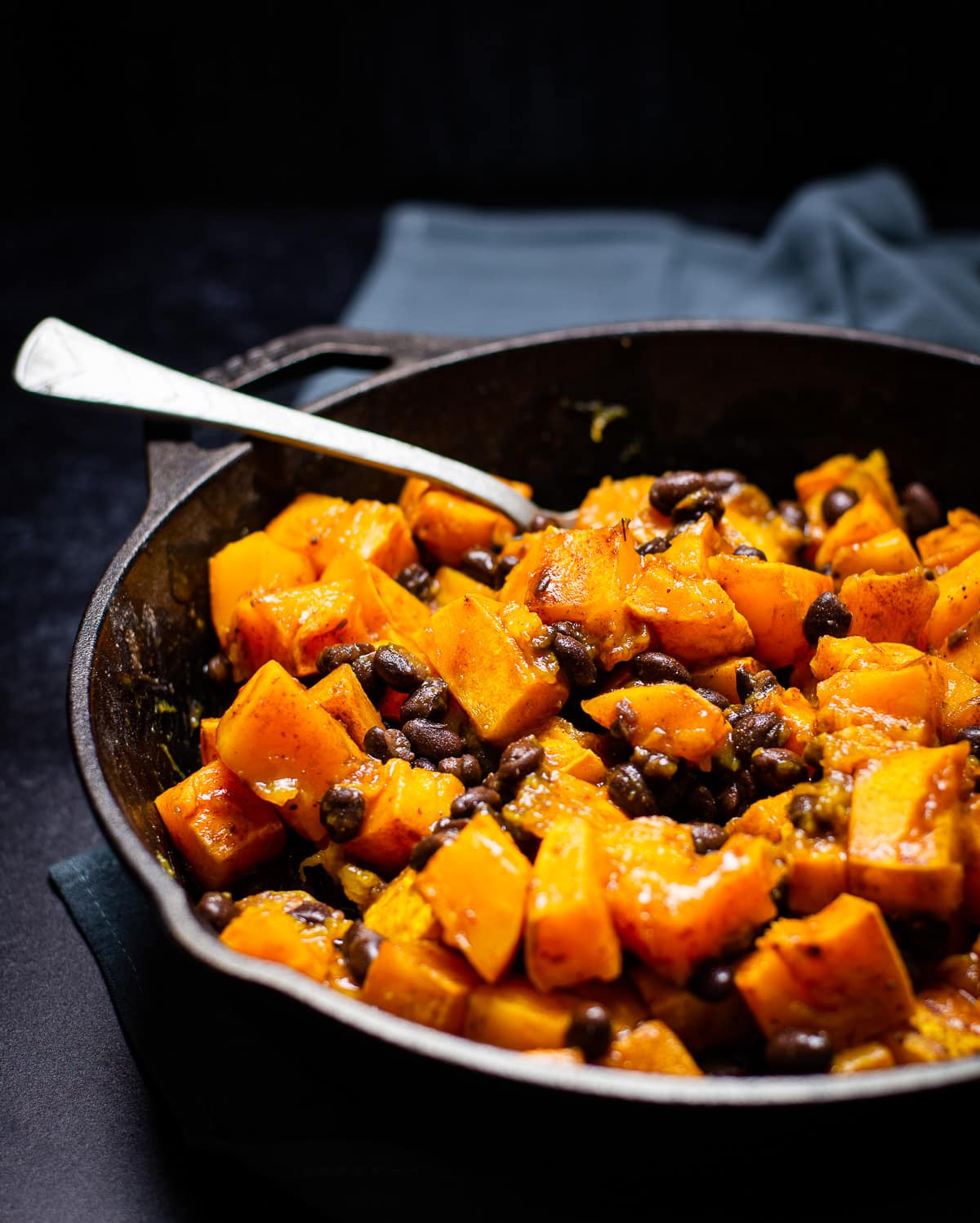 Butternut squash and black bean in skillet.