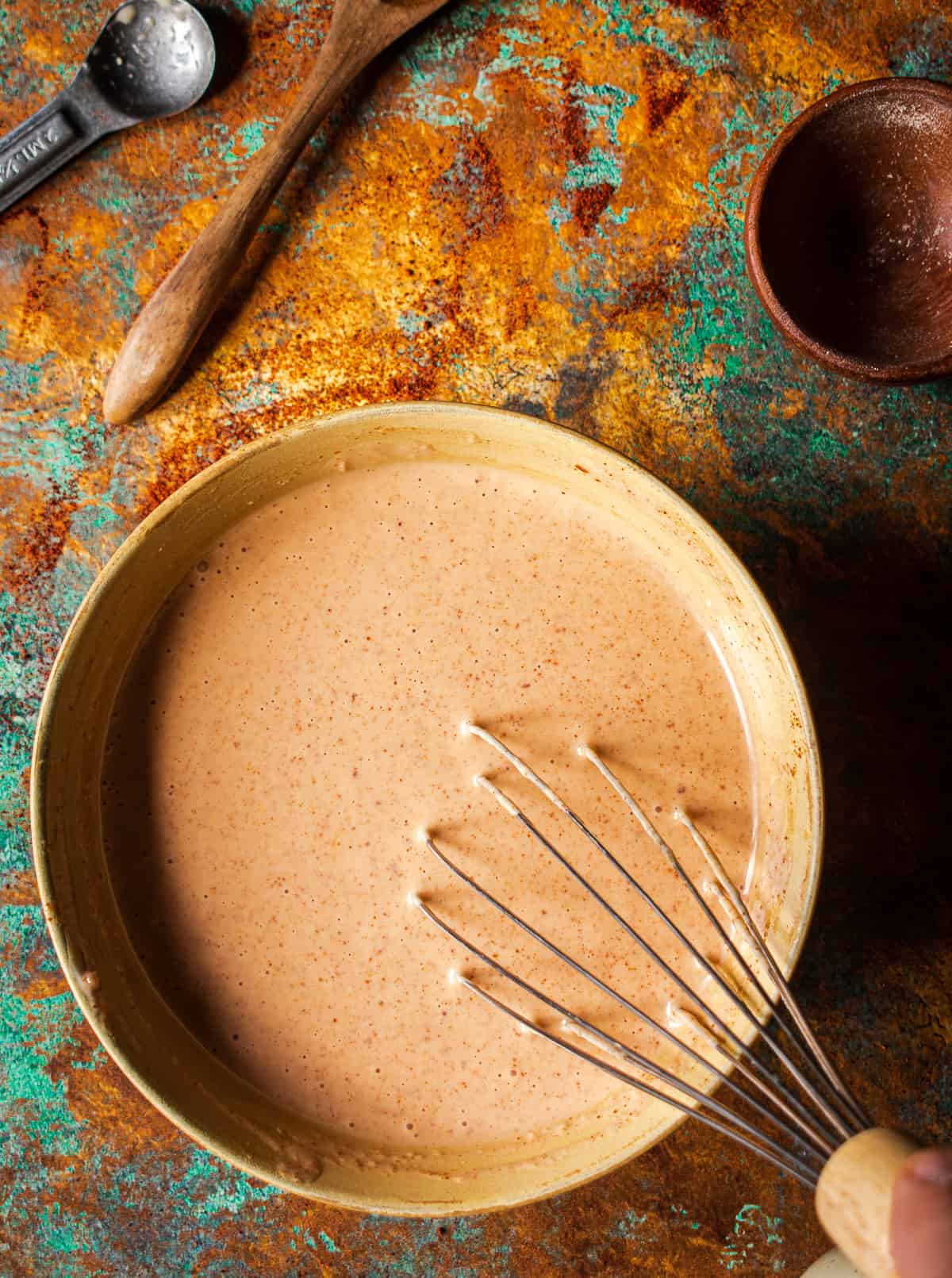 whisk in bowl with comeback sauce