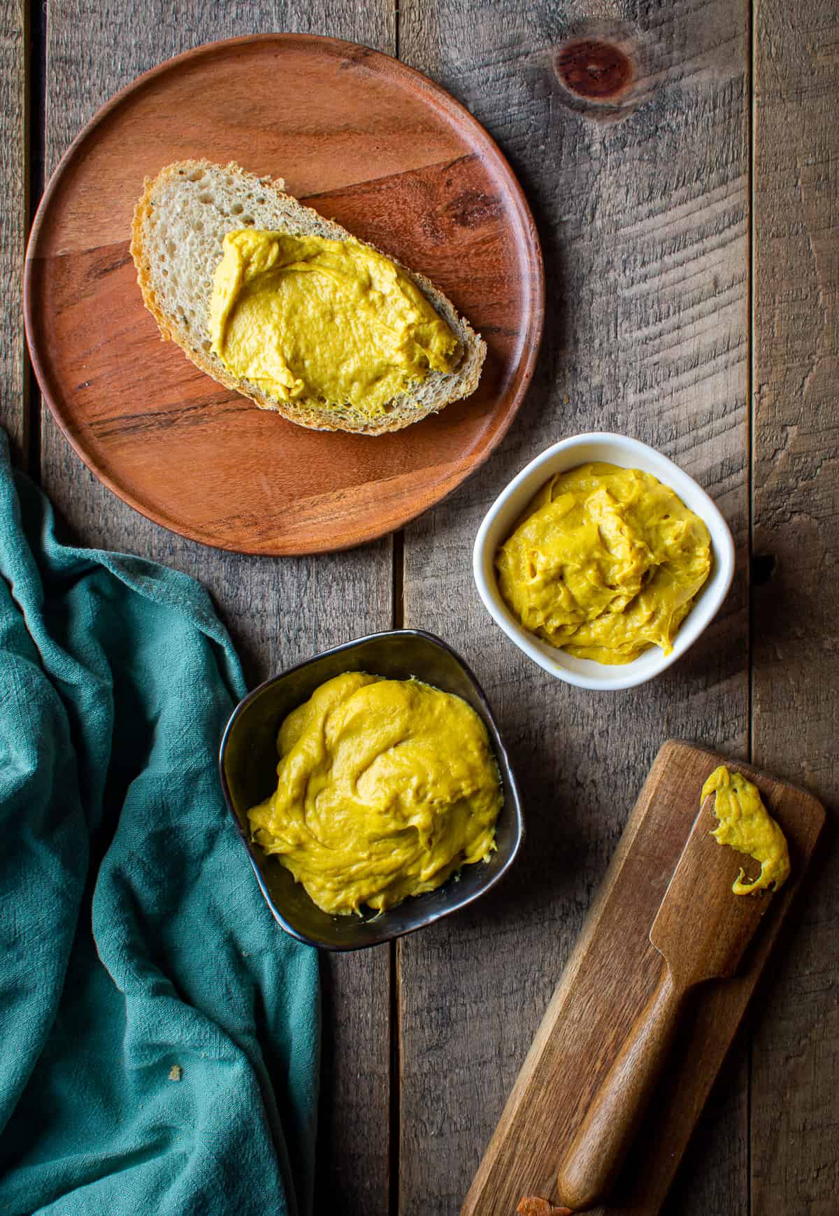 vegan cheddar cheese in bowls and on toast