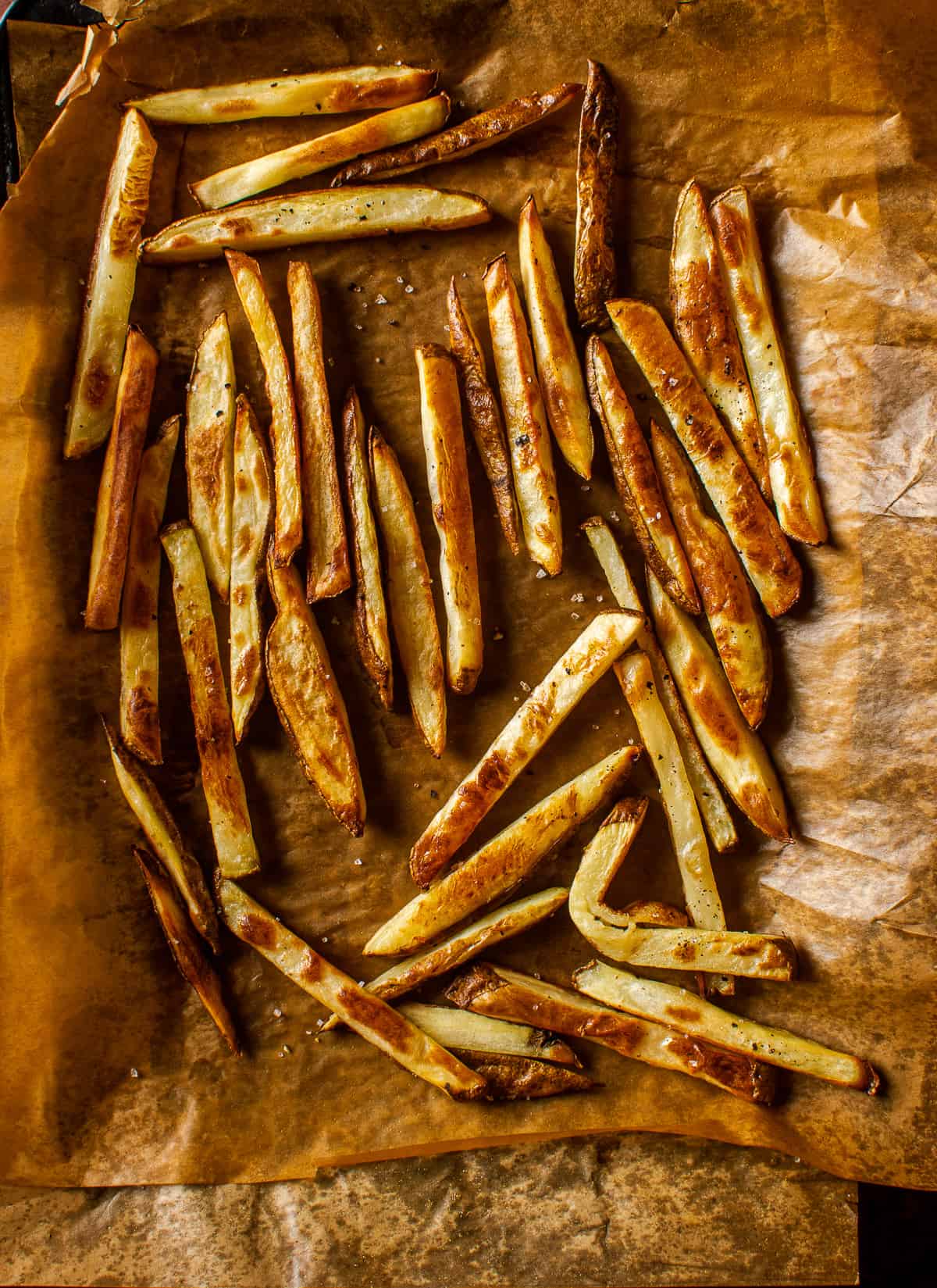 baked french fries on parchement paper