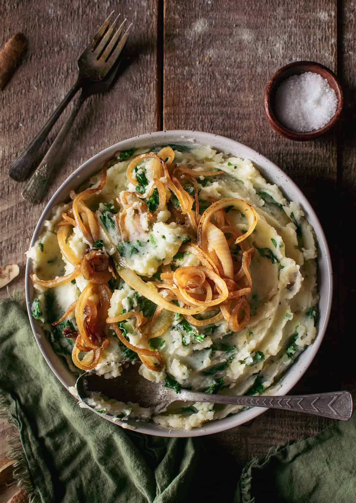 vegan colcannon in bowl with caramelized onions