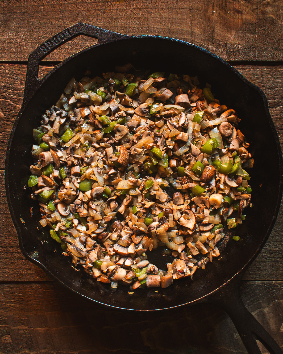 Mushrooms and onions in skillet.