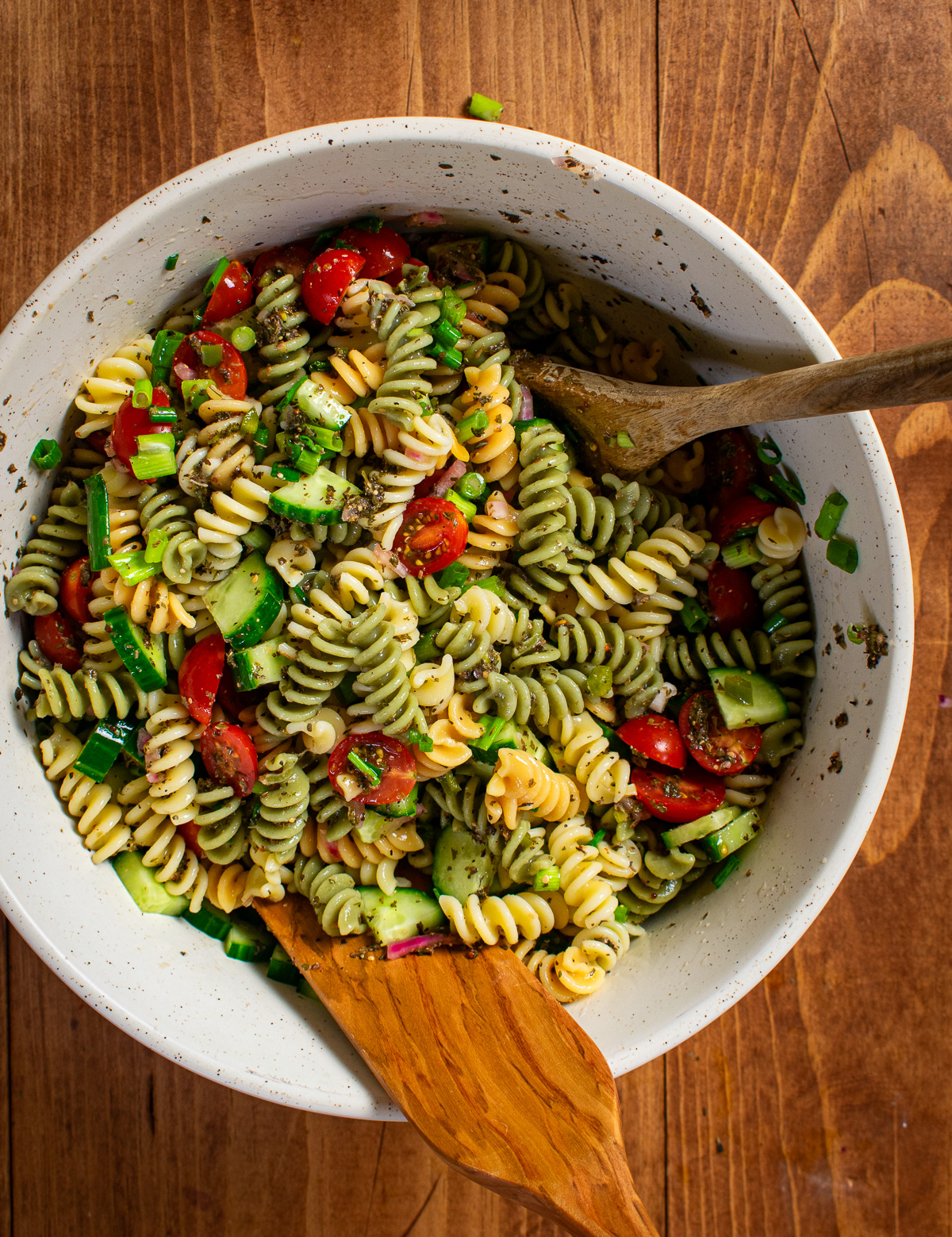 Pasta salad in mixing bowl.